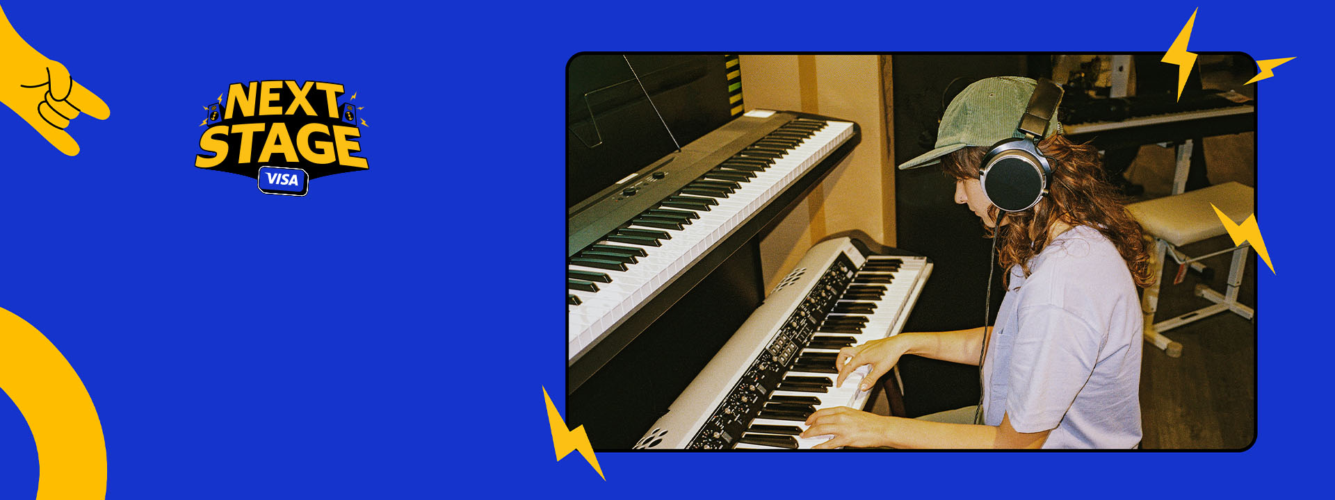 Person wearing headphones playing an electronic keyboard in a music studio, with Next Stage Visa branding.
