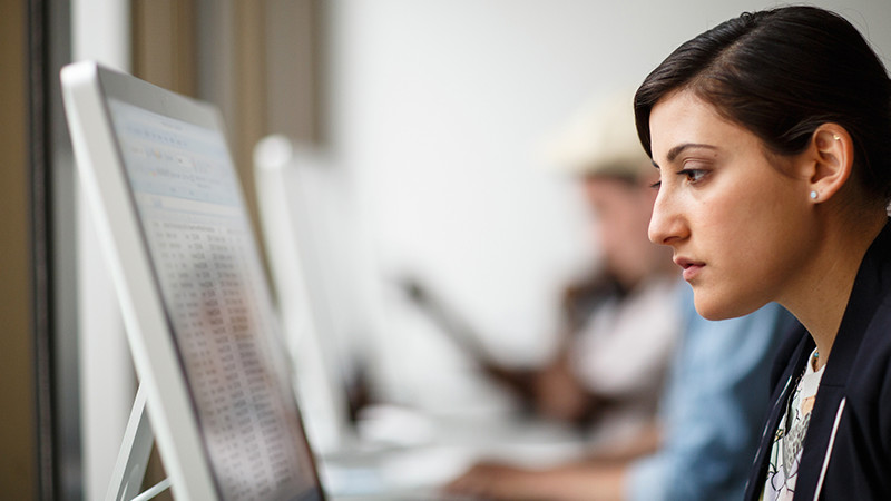 woman looking at computer screen