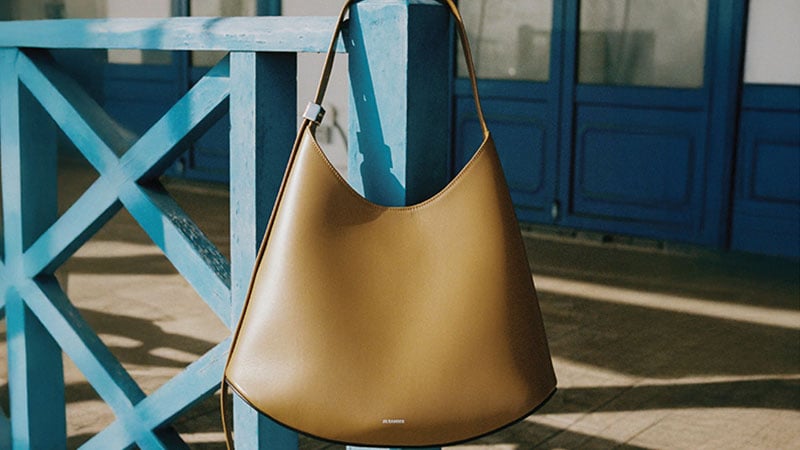 The brown leather bag weighs