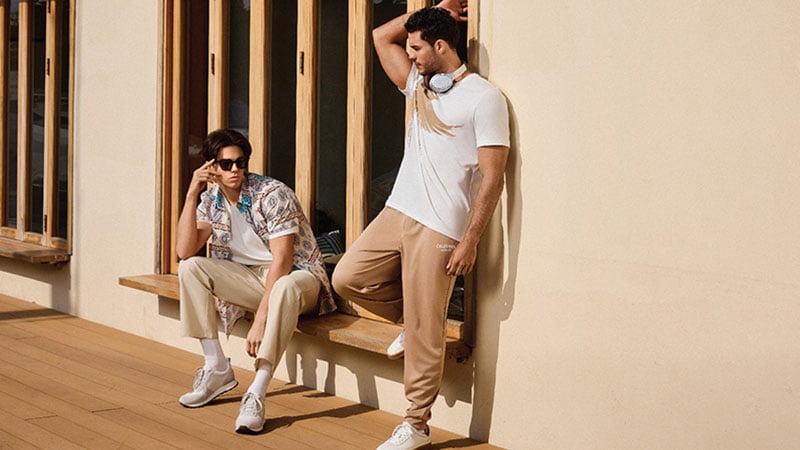 Two human models present clothes