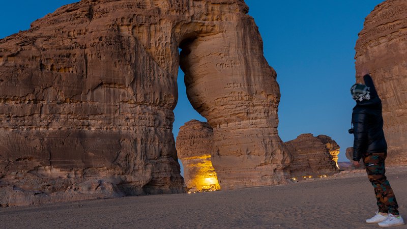 A person looking at Elephant rock in Saudi Arabia Alula