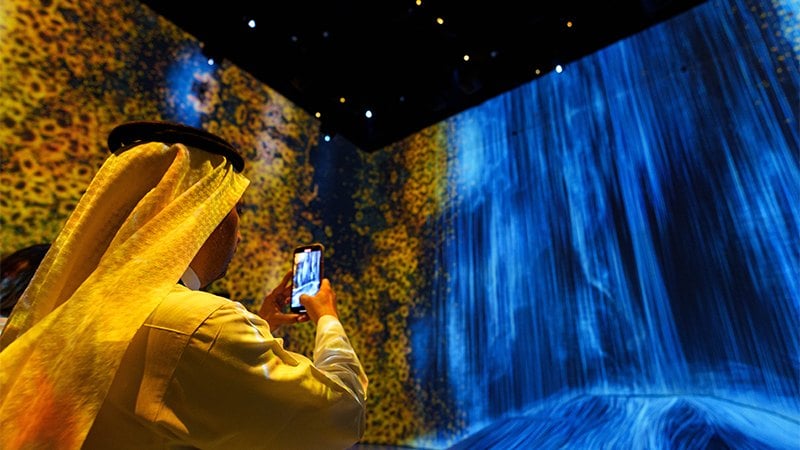 Saudi man taking a photo of the visual show